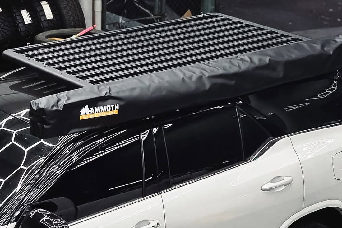 Vehicle fitted with a sturdy roof rack for carrying camping gear and outdoor equipment