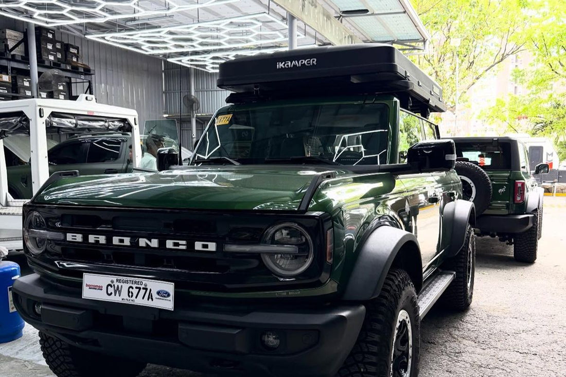 Ford Bronco equipped with a rooftop camping rig and off-road accessories for outdoor adventures