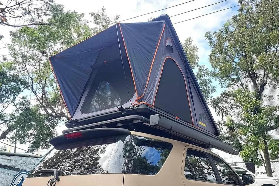 Off-road vehicle equipped with a rooftop tent for camping and overlanding adventures